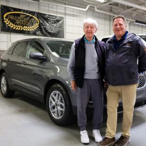 Bill Brown Ford Sales Associate Thom Howard and AXZ Plan Customer